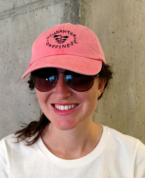 One Women Wearning Guarantee Happiness Logo Hat