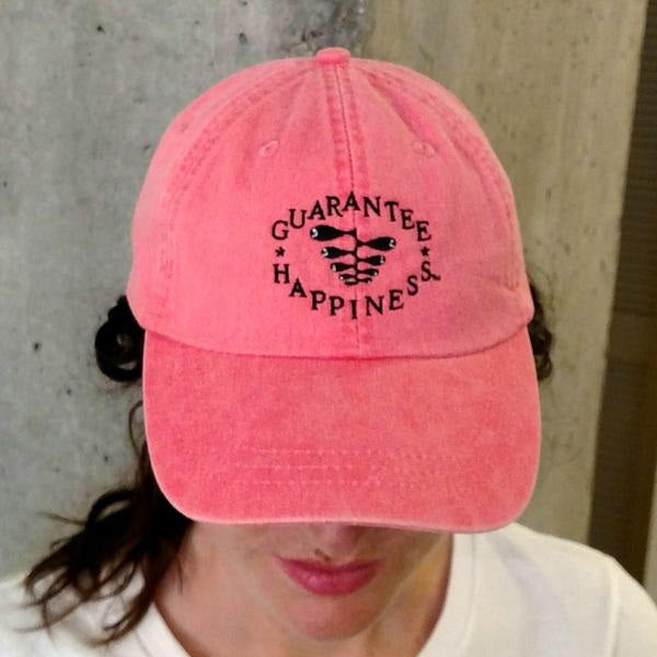 One Women Wearning Guarantee Happiness Logo Hat from Different Angle